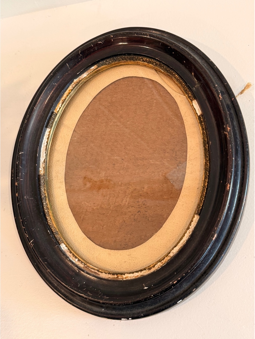 Antique oval black wood picture frame with convex glass
